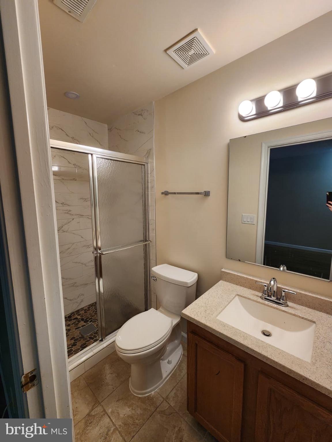 45033 Fellowship Square Ashburn, VA 20147 - Photo 35 of 37 a bathroom with a sink toilet and shower