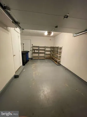 a view of empty room with white walls