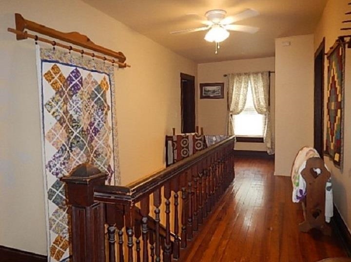 1312 Raphine Road Raphine, VA 24472 - Photo 16 of 30 a view of a hallway with wooden floor and staircase