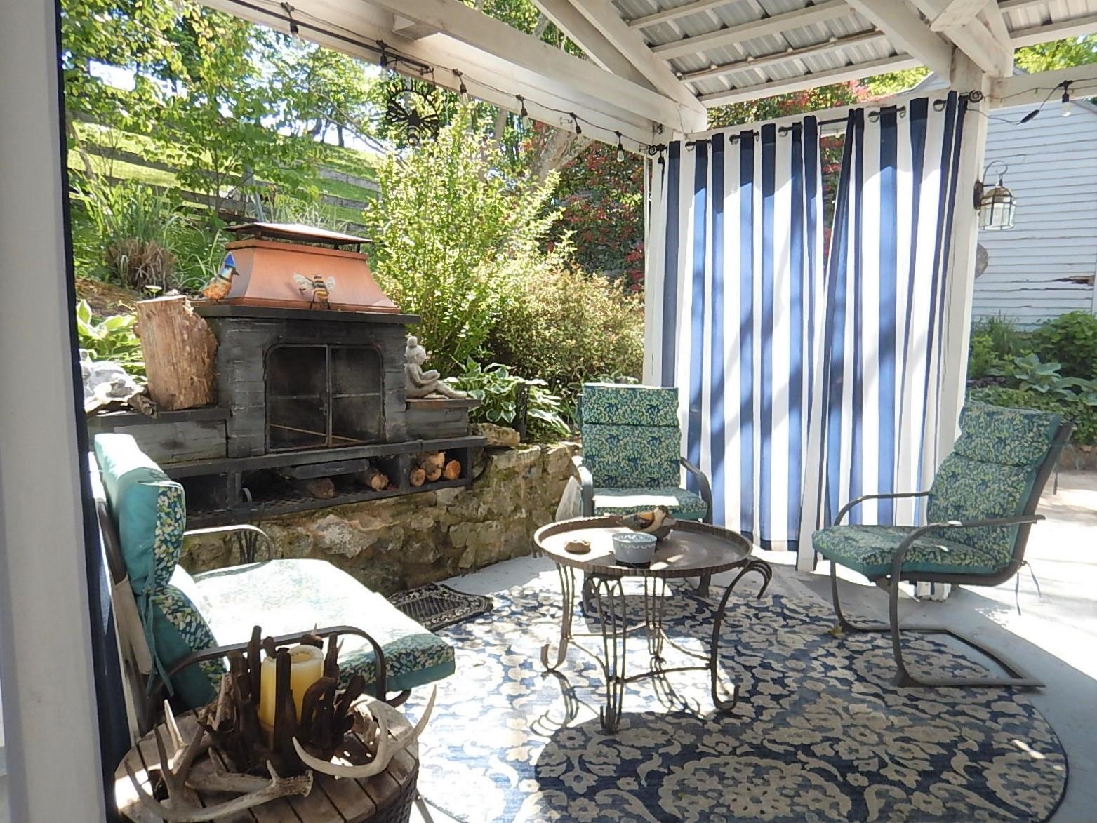 1312 Raphine Road Raphine, VA 24472 - Photo 29 of 30 a view of a patio with table and chairs and potted plants