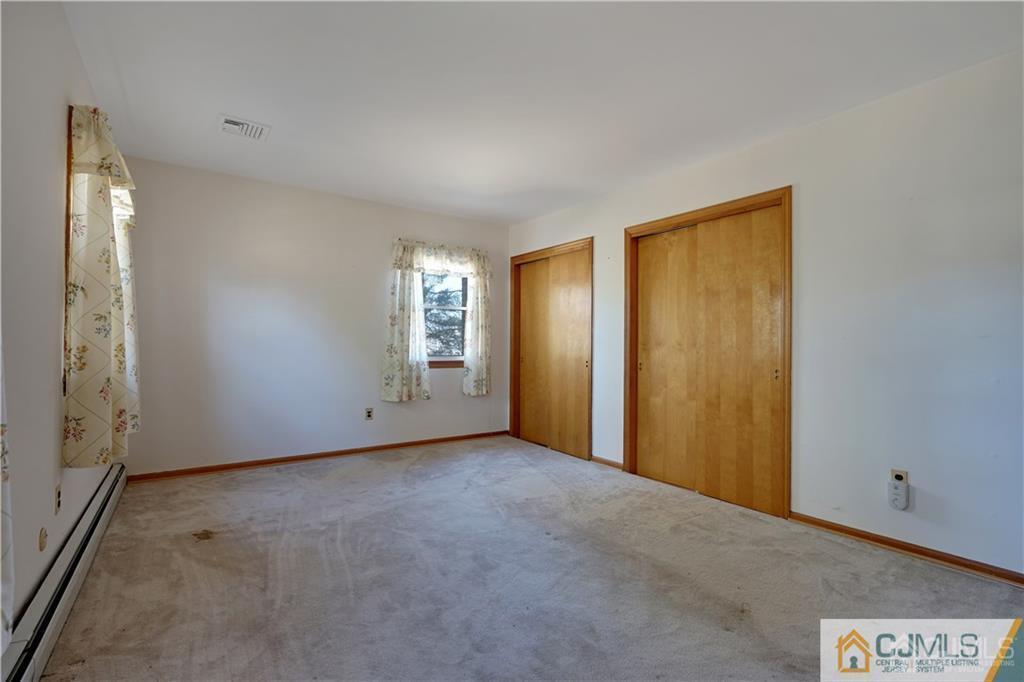 124 Sunset Road Belle Mead, NJ 08502 - Photo 20 of 29 a view of an empty room and window