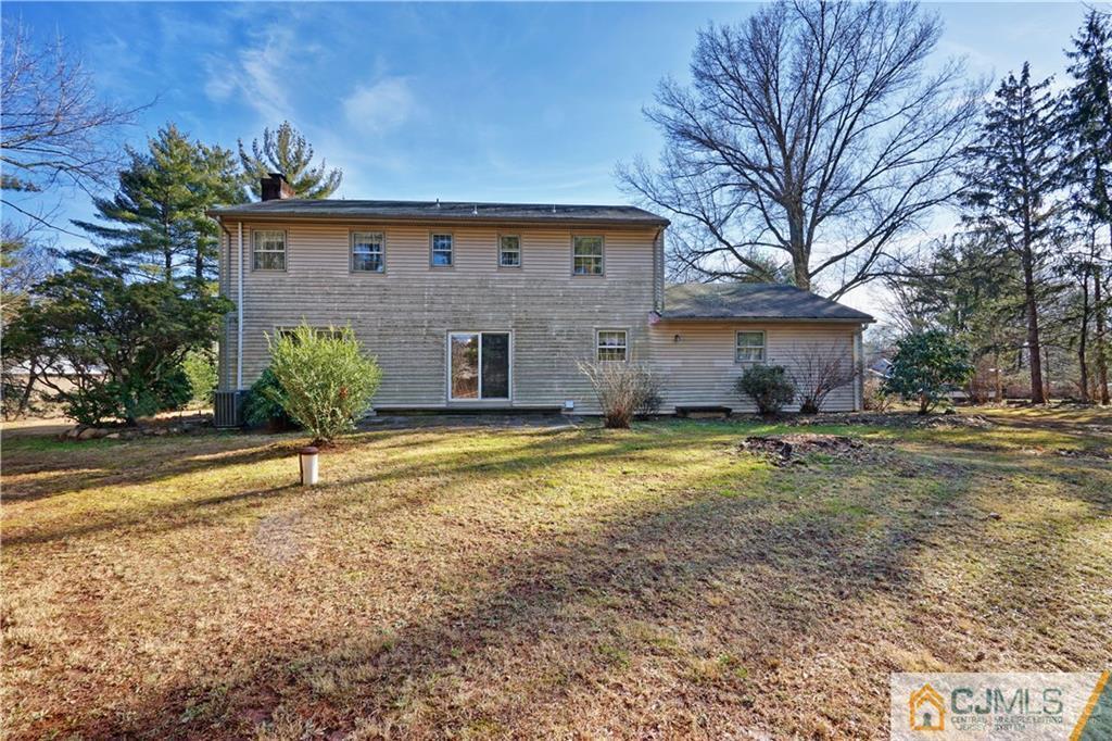 124 Sunset Road Belle Mead, NJ 08502 - Photo 26 of 29 a view of a house with a yard and tree s