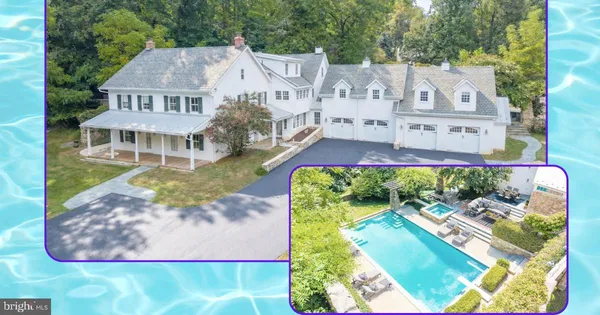 an aerial view of a house with swimming pool and garden space