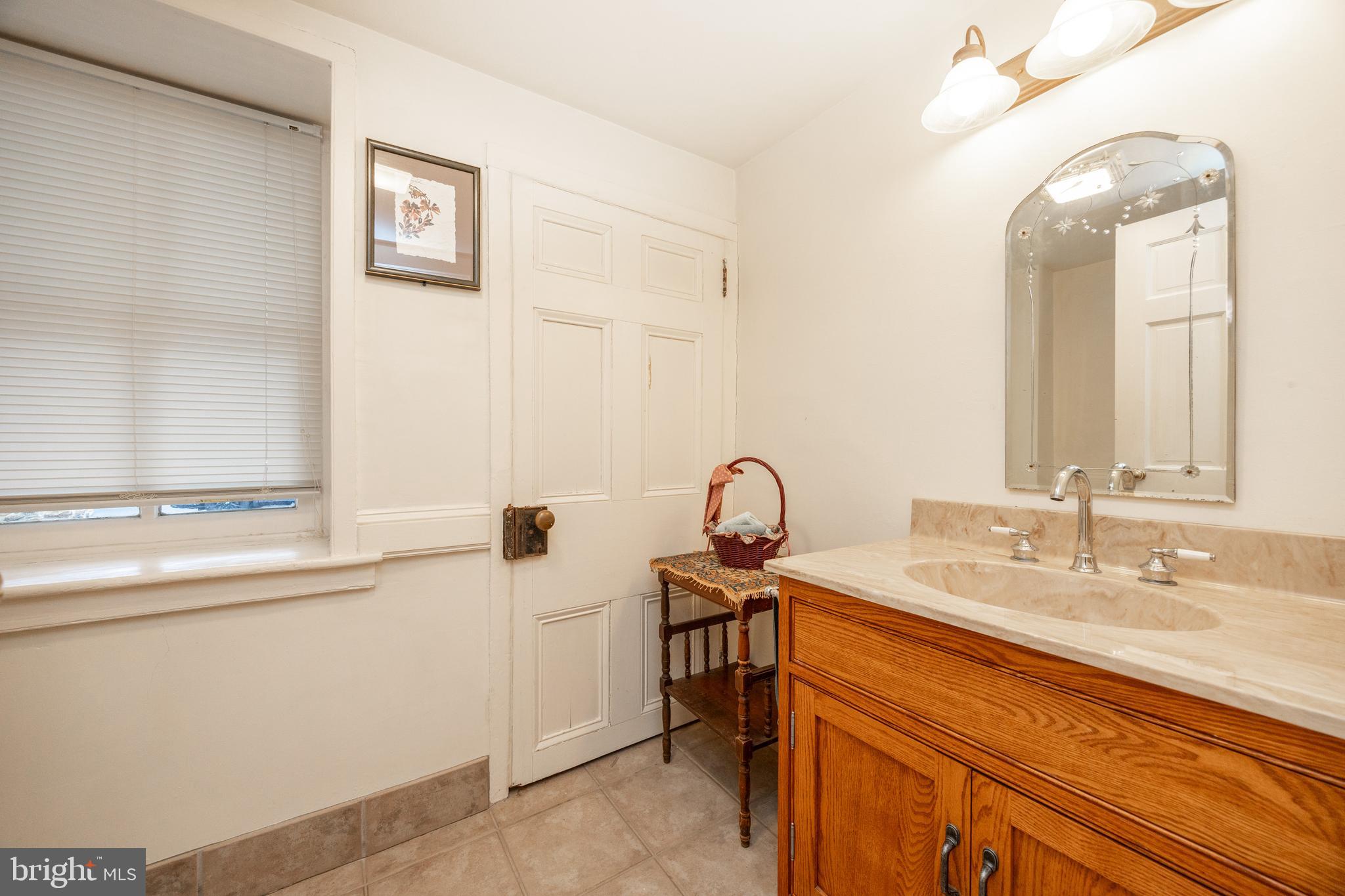580 Reeds Road Downingtown, PA 19335 - Photo 13 of 82 a bathroom with a sink and a mirror