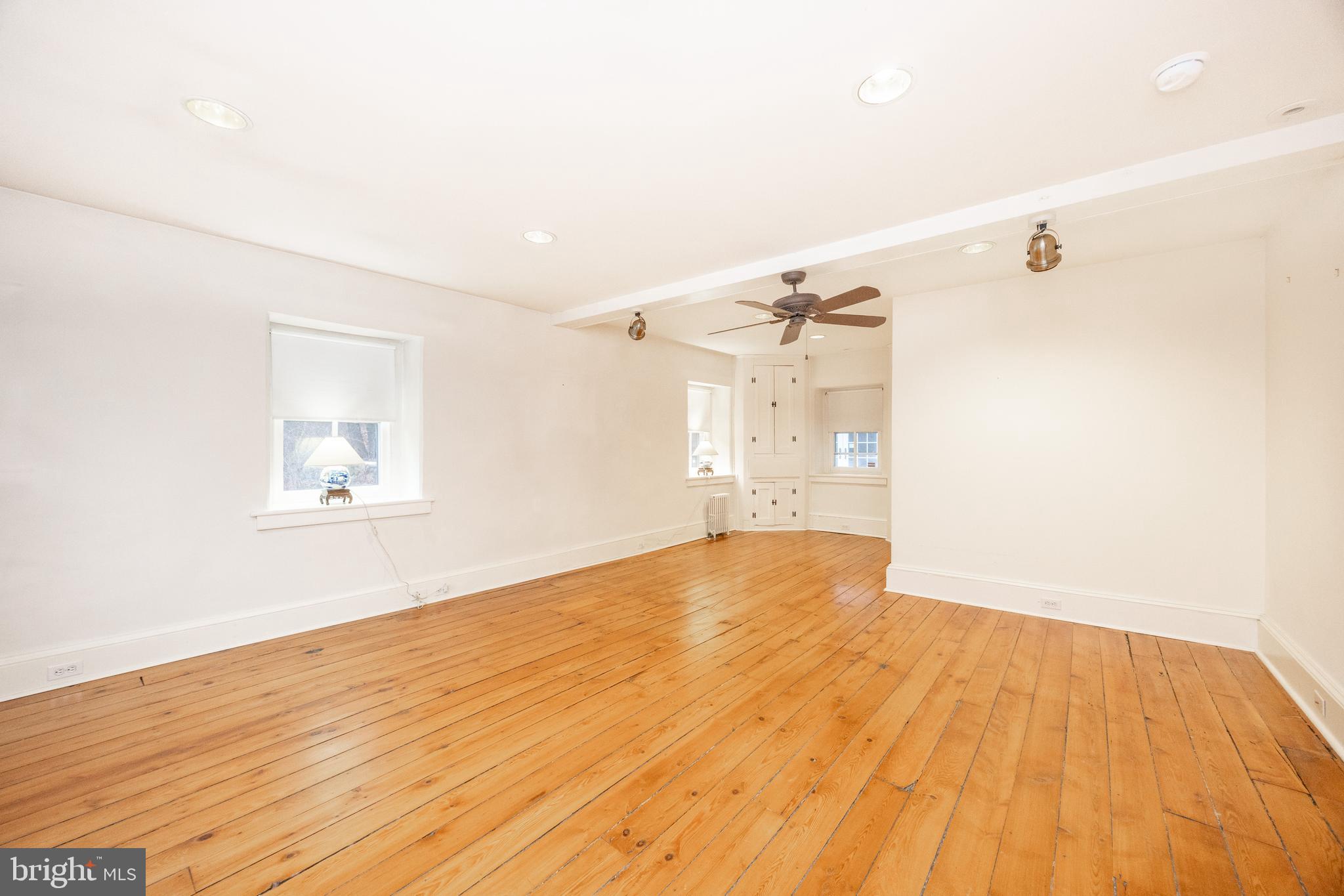 580 Reeds Road Downingtown, PA 19335 - Photo 21 of 82 a view of empty room with wooden floor and fan