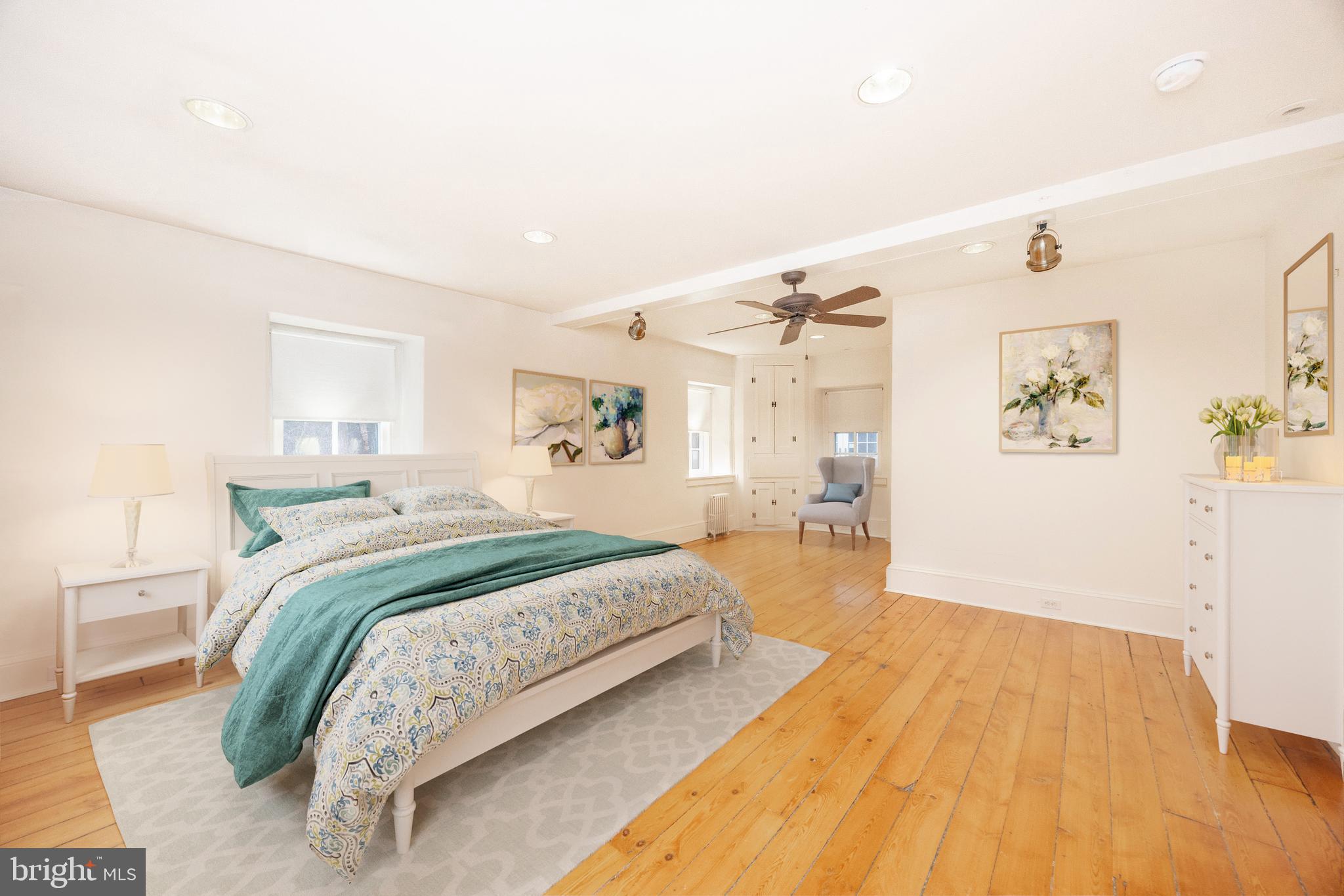 580 Reeds Road Downingtown, PA 19335 - Photo 22 of 82 a spacious bedroom with a bed and a wooden floor