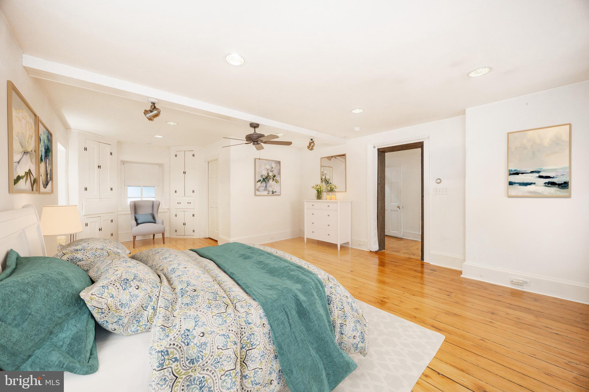 580 Reeds Road Downingtown, PA 19335 - Photo 23 of 82 a spacious bedroom with a bed and a wooden floor