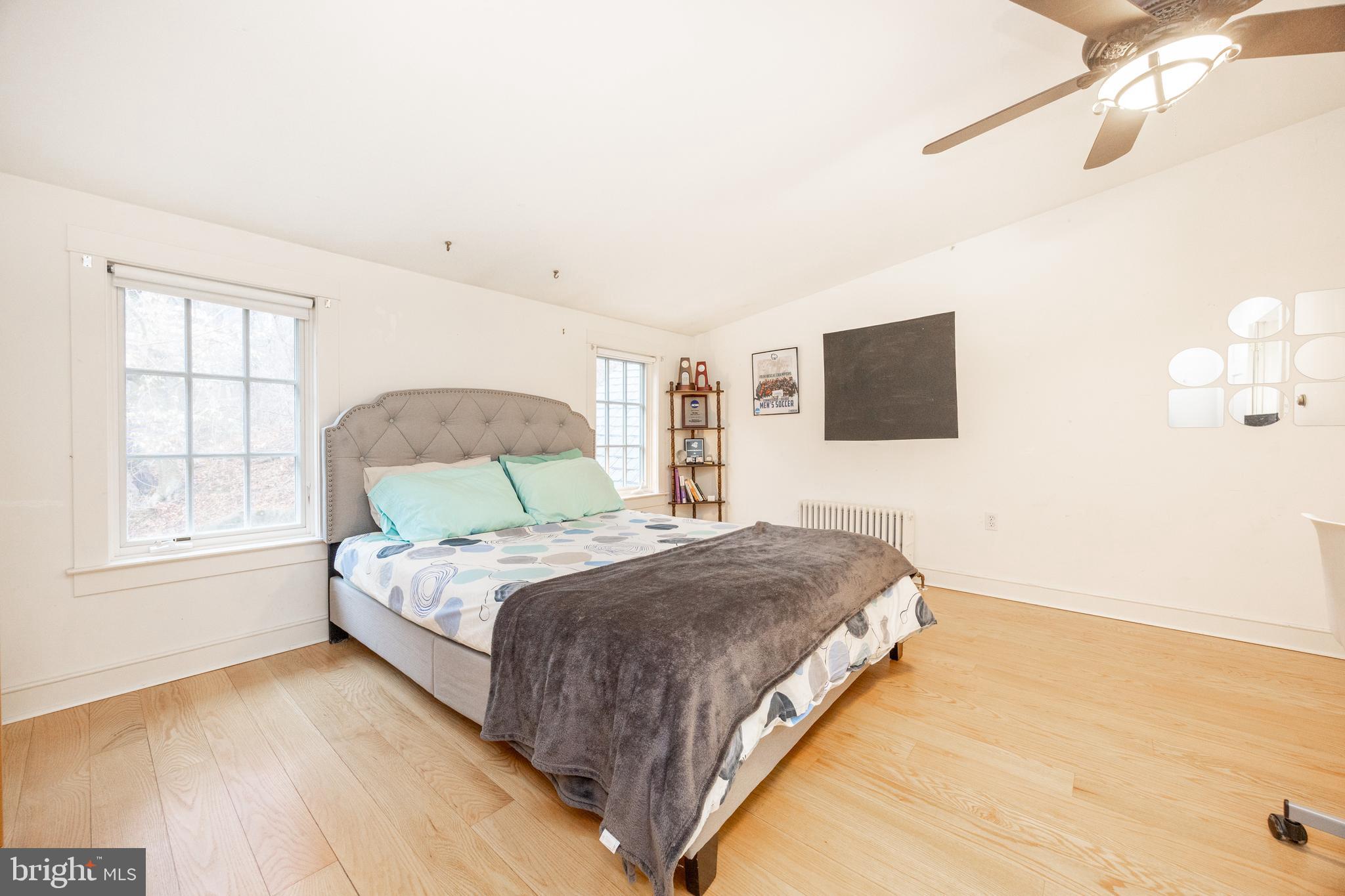580 Reeds Road Downingtown, PA 19335 - Photo 28 of 82 a bedroom with a bed window and a flat screen tv