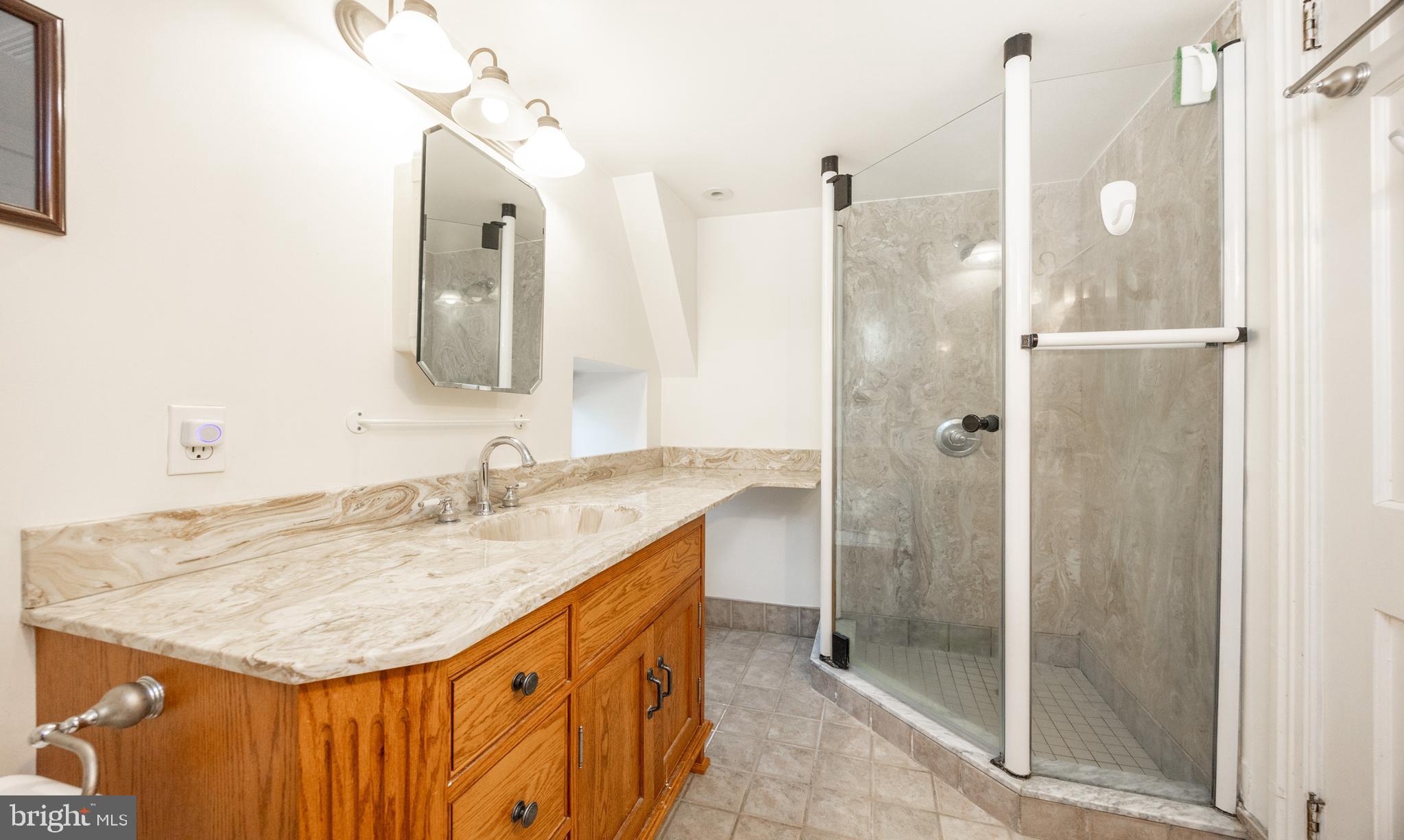 580 Reeds Road Downingtown, PA 19335 - Photo 31 of 82 a bathroom with a granite countertop sink and a mirror