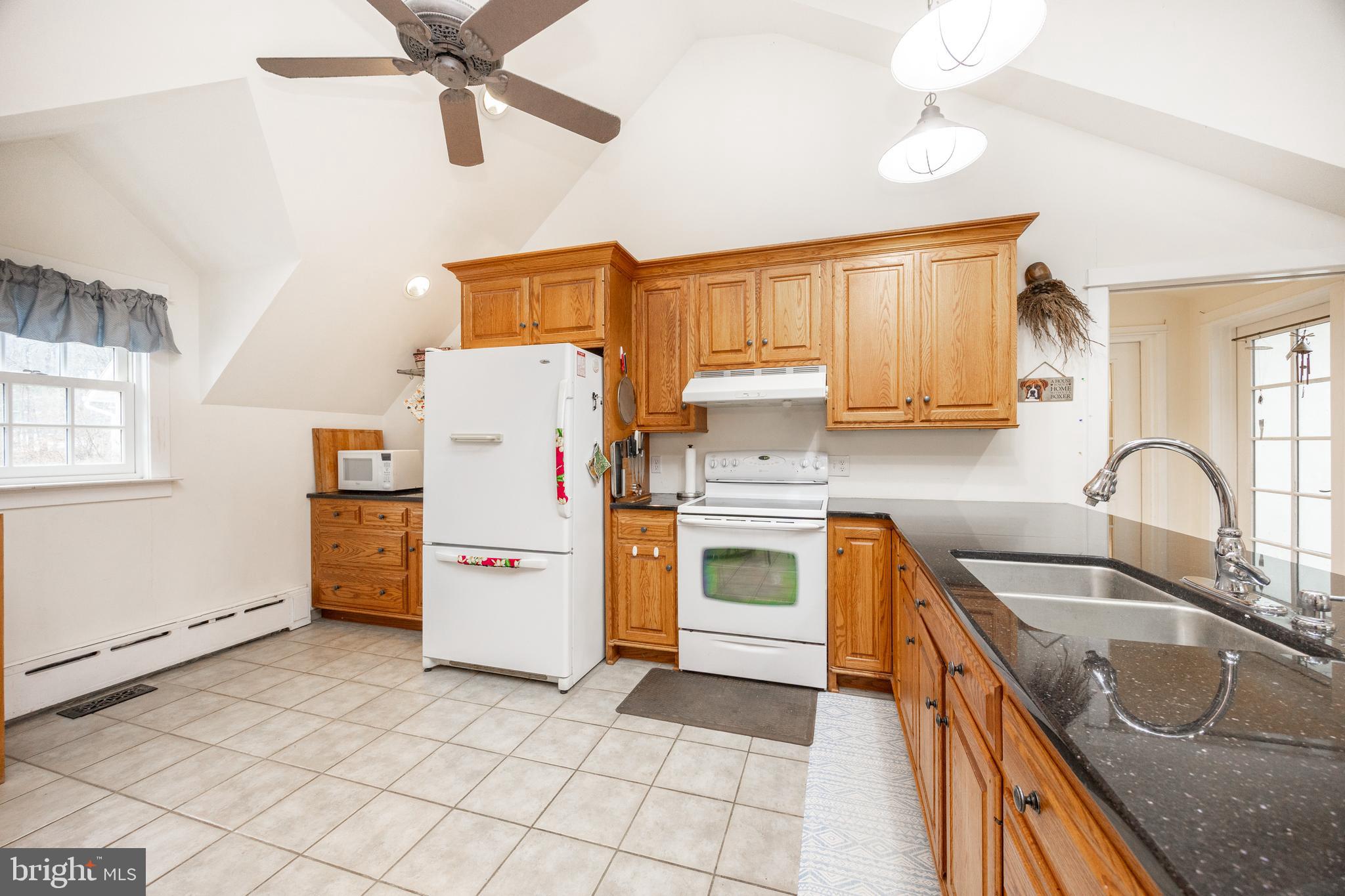 580 Reeds Road Downingtown, PA 19335 - Photo 53 of 82 a kitchen with a stove sink and a refrigerator