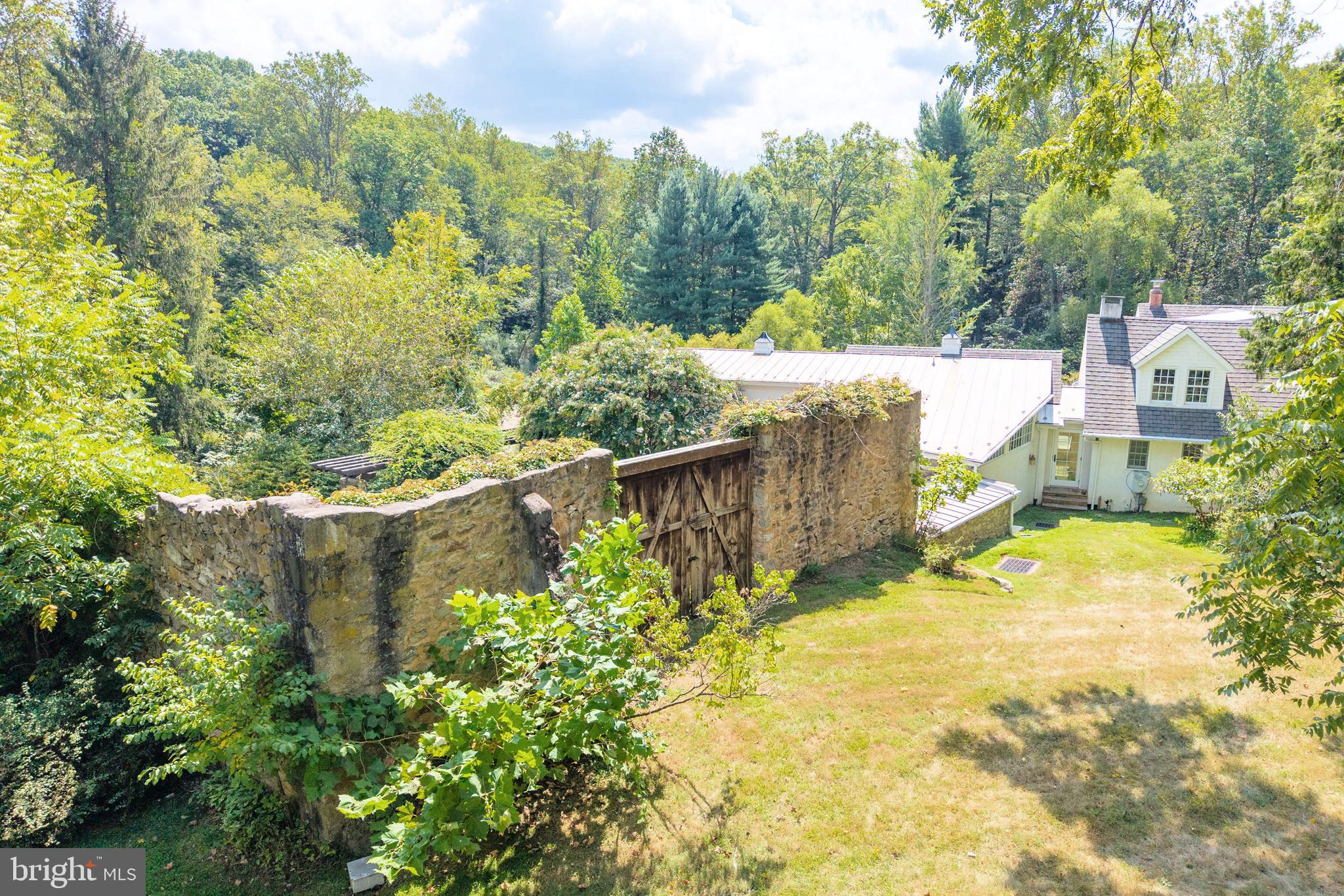 580 Reeds Road Downingtown, PA 19335 - Photo 66 of 82 a view of a yard with plants and large trees