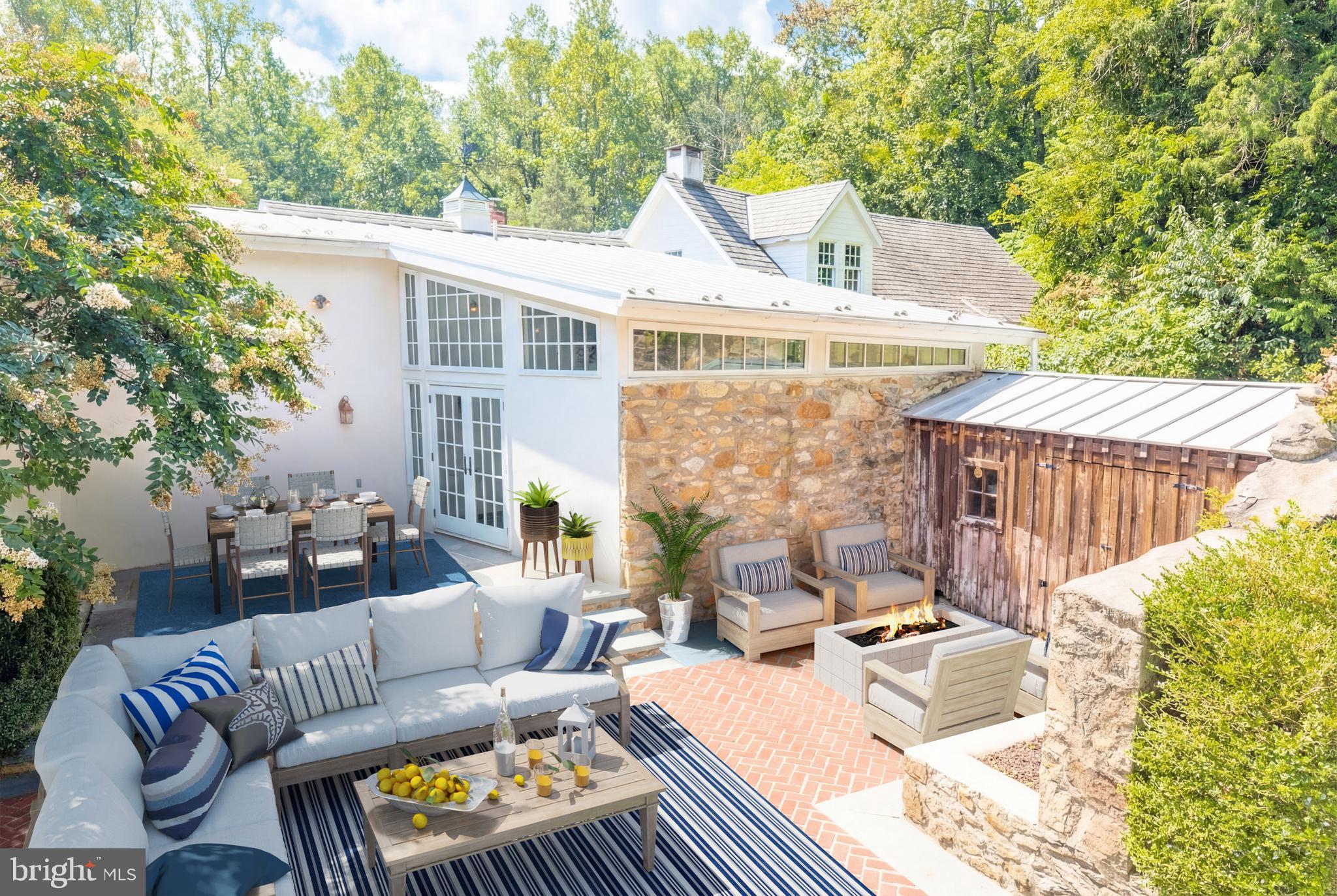580 Reeds Road Downingtown, PA 19335 - Photo 75 of 82 a view of a patio with couches table and chairs and potted plants