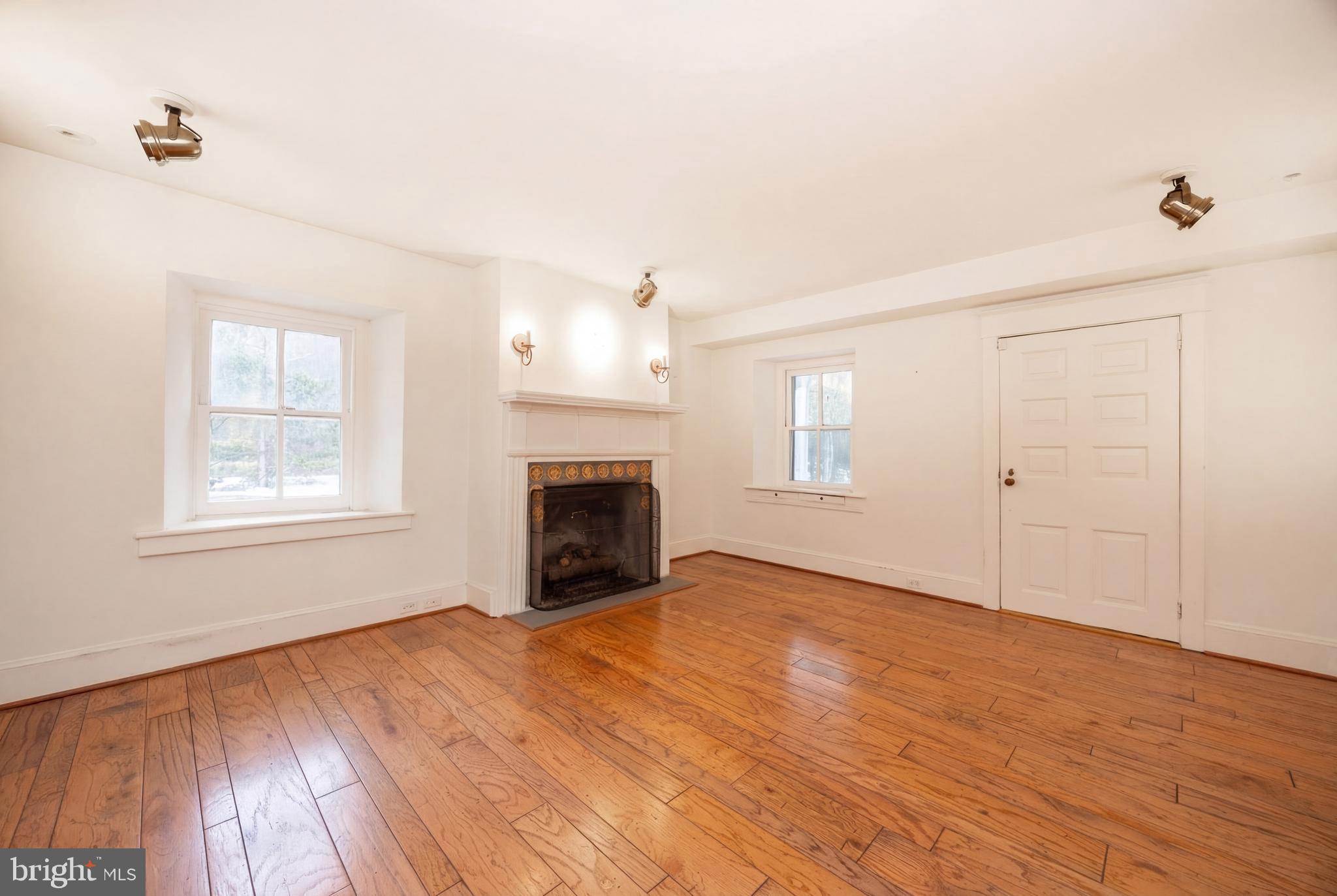 580 Reeds Road Downingtown, PA 19335 - Photo 9 of 82 a view of empty room with wooden floor and fan