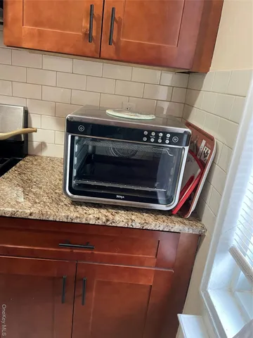 a close view of a stove top oven sitting inside of a kitchen