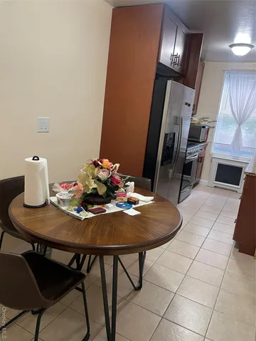 a dining room with furniture and chandelier