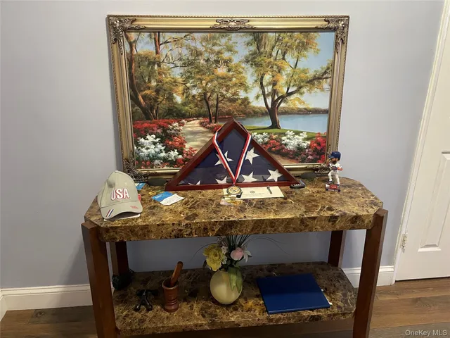 a table with wine bottles and glasses on it