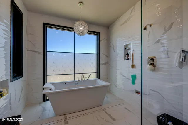 a bath tub sitting next to a window