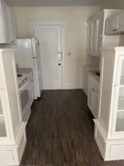 a view of storage and utility room with a fireplace