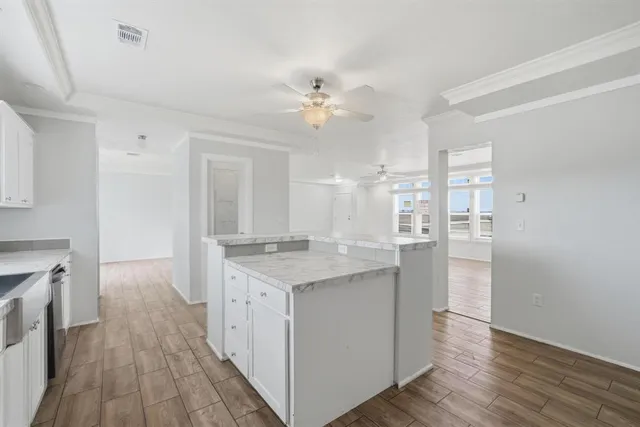 a kitchen with a sink and a refrigerator