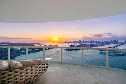 a view of a terrace with couches and sky view