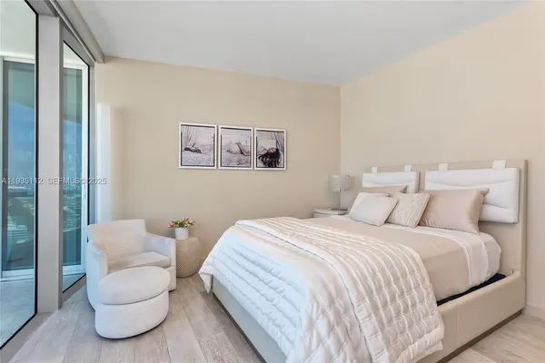 a bedroom with a bed and a couch