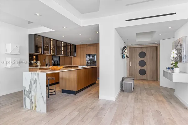 a kitchen with a refrigerator and window