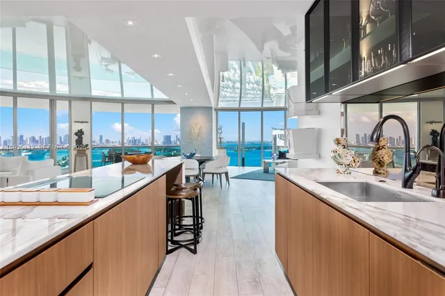 a kitchen with counter top space a sink and cabinets
