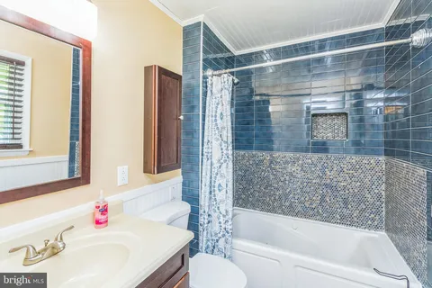 a bathroom with a sink and a shower