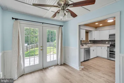 a view of a kitchen with a stove cabinets and a wooden floor