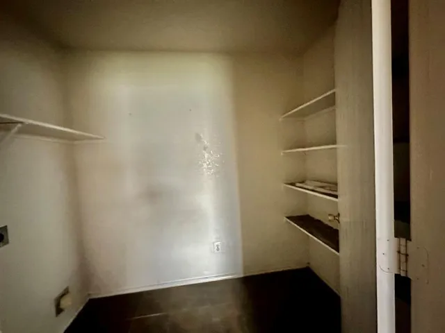 a view of a room with racks on the wall