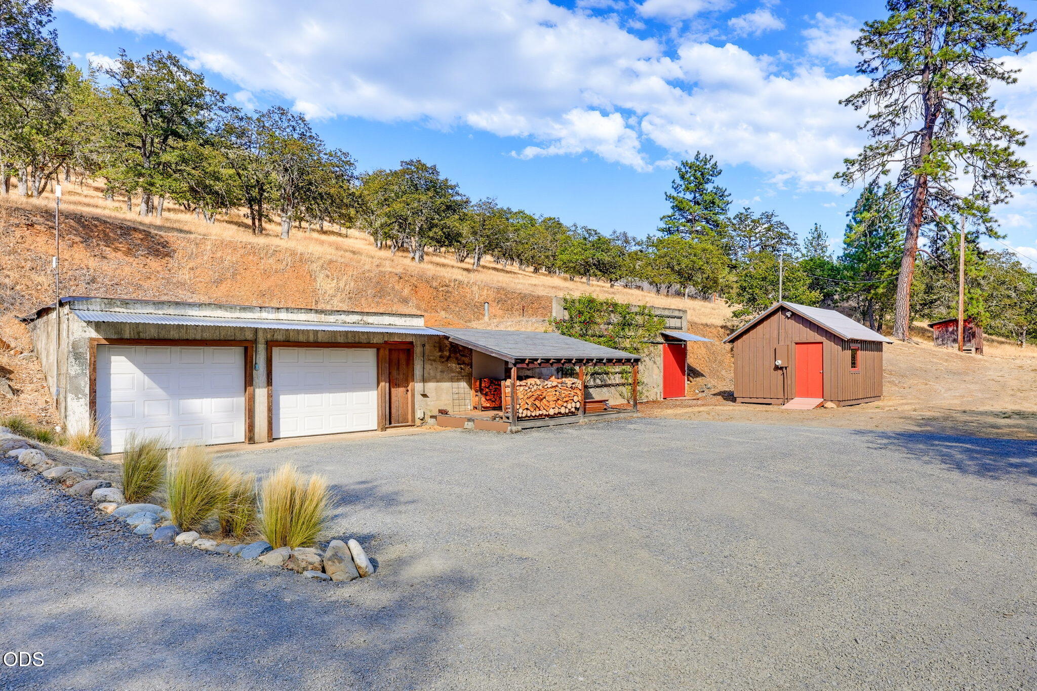 2459 Little Applegate Road Jacksonville, OR 97530 - Photo 60 of 86 a front view of a house with a yard and garage