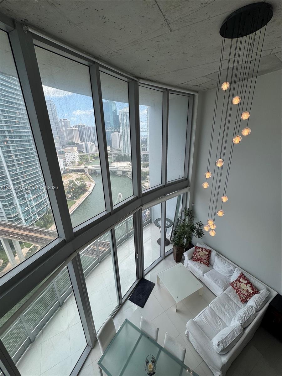 690 Southwest 1st Court, Unit 2301 Miami, FL 33130 - Photo 22 of 26 a view of a living room and a window