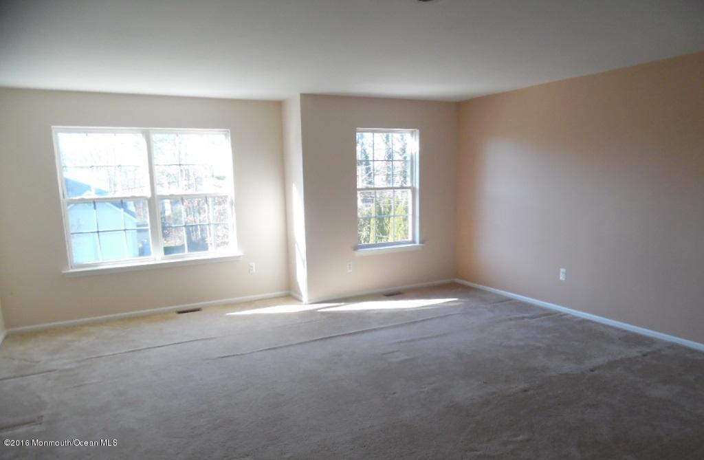 116 Lanyard Road Manahawkin, NJ 08050 - Photo 5 of 11 an empty room with windows