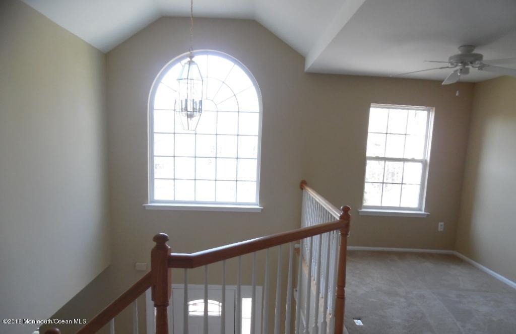 116 Lanyard Road Manahawkin, NJ 08050 - Photo 7 of 11 a view of an empty room and window