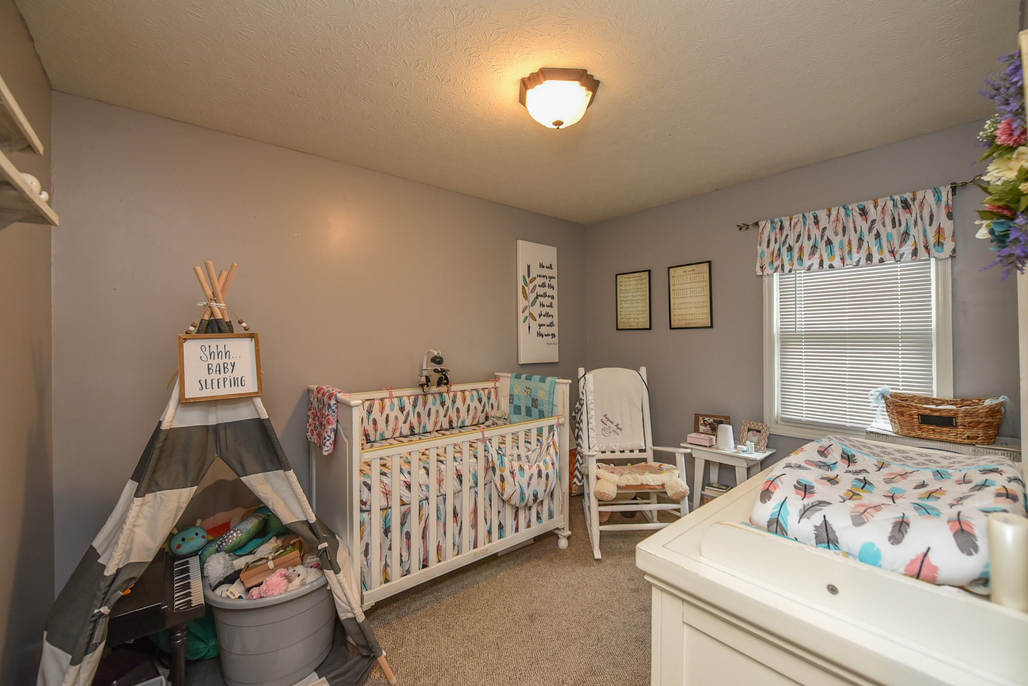 1840 Rock Bridge Road Bethpage, TN 37022 - Photo 14 of 14 a bedroom with a bed and a couch