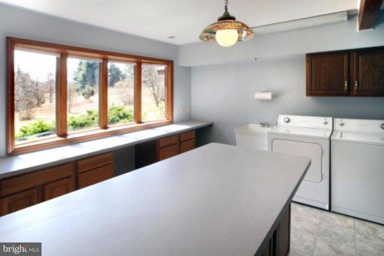 17915 Marshall Mill Road Hampstead, MD 21074 - Photo 4 of 30 a kitchen with a large window appliances and furniture