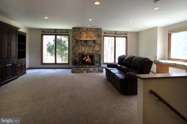 17915 Marshall Mill Road Hampstead, MD 21074 - Photo 5 of 30 a living room with furniture and a flat screen tv