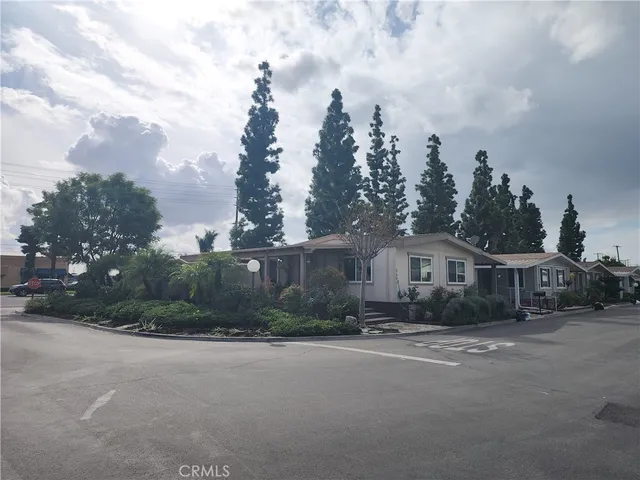 a view of house with a swimming pool