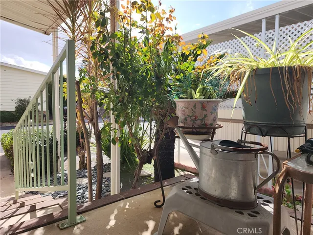a view of balcony with table and chairs