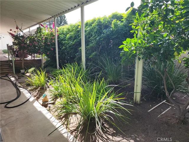 a view of an outdoor space with wooden deck