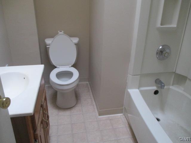1037 Spring Street Bethlehem, PA 18018 - Photo 6 of 11 a bathroom with a toilet sink and mirror