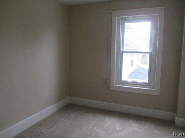 1037 Spring Street Bethlehem, PA 18018 - Photo 8 of 11 an empty room with a window