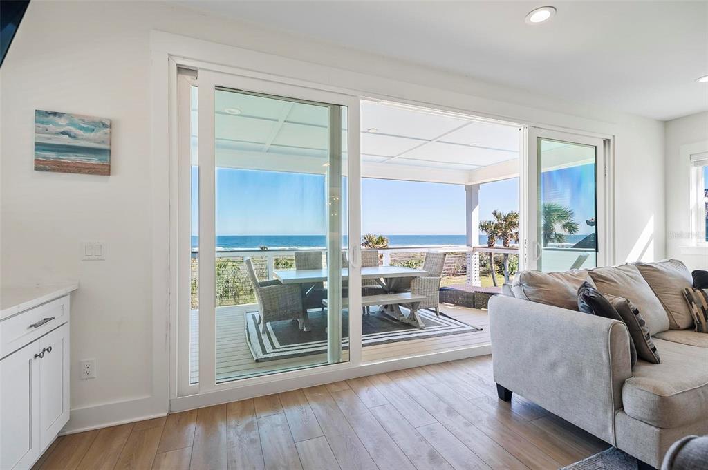 200 Surfview Drive Palm Coast, FL 32137 - Photo 16 of 70 a living room with furniture and a large window