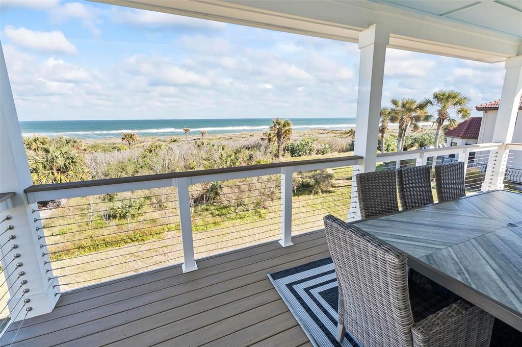 200 Surfview Drive Palm Coast, FL 32137 - Photo 19 of 70 a view of a balcony with wooden floor and outdoor space