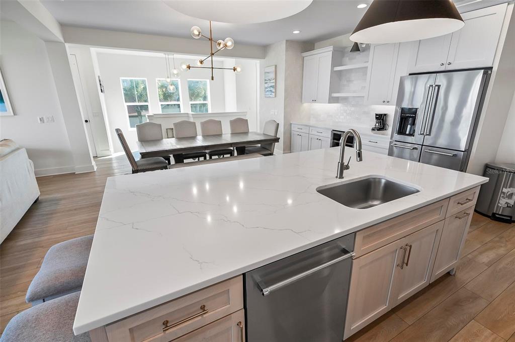 200 Surfview Drive Palm Coast, FL 32137 - Photo 25 of 70 a large white kitchen with stainless steel appliances