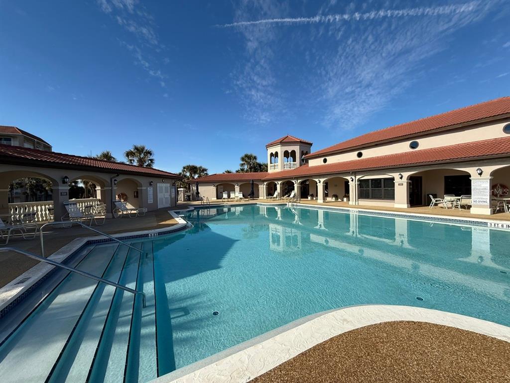 200 Surfview Drive Palm Coast, FL 32137 - Photo 60 of 70 a front view of a house with a yard