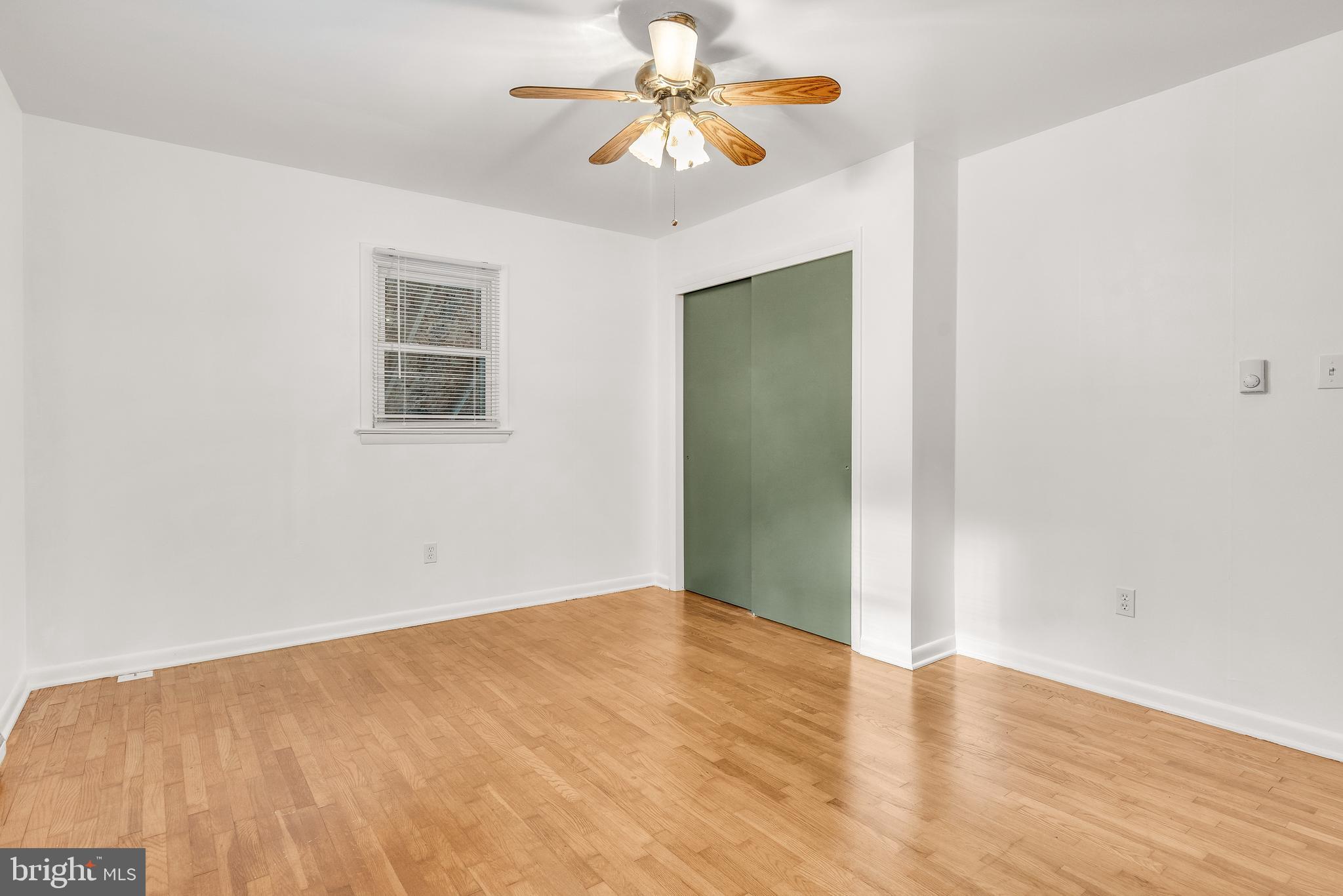 310 North Fairfax Boulevard Ranson, WV 25438 - Photo 20 of 36 an empty room with a fan and a window
