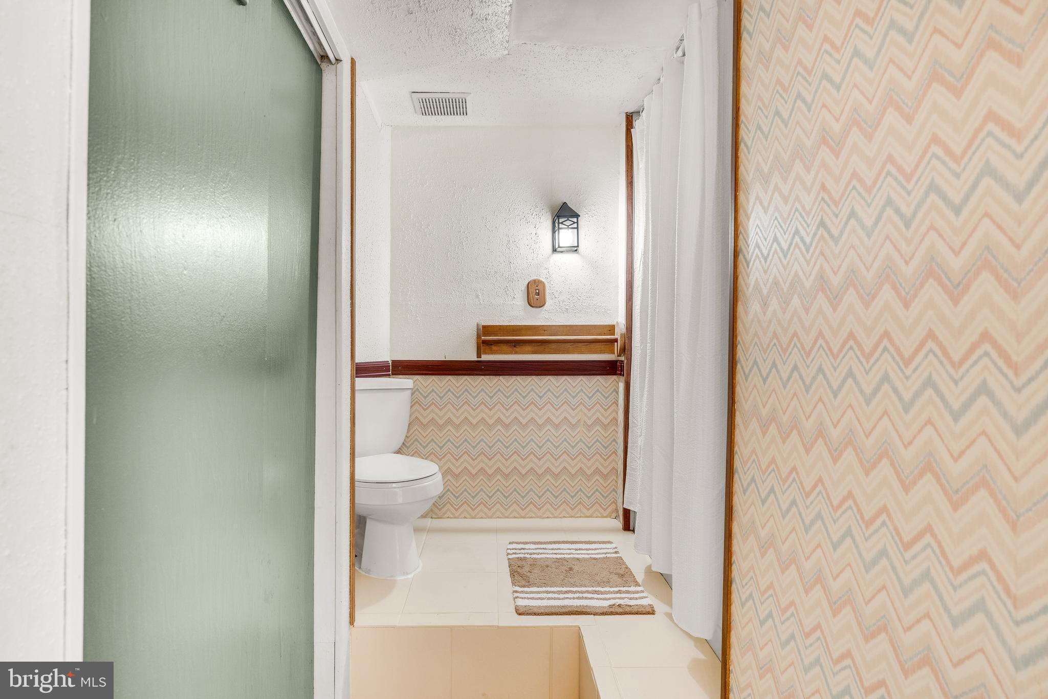 310 North Fairfax Boulevard Ranson, WV 25438 - Photo 25 of 36 a bathroom with a toilet and a shower