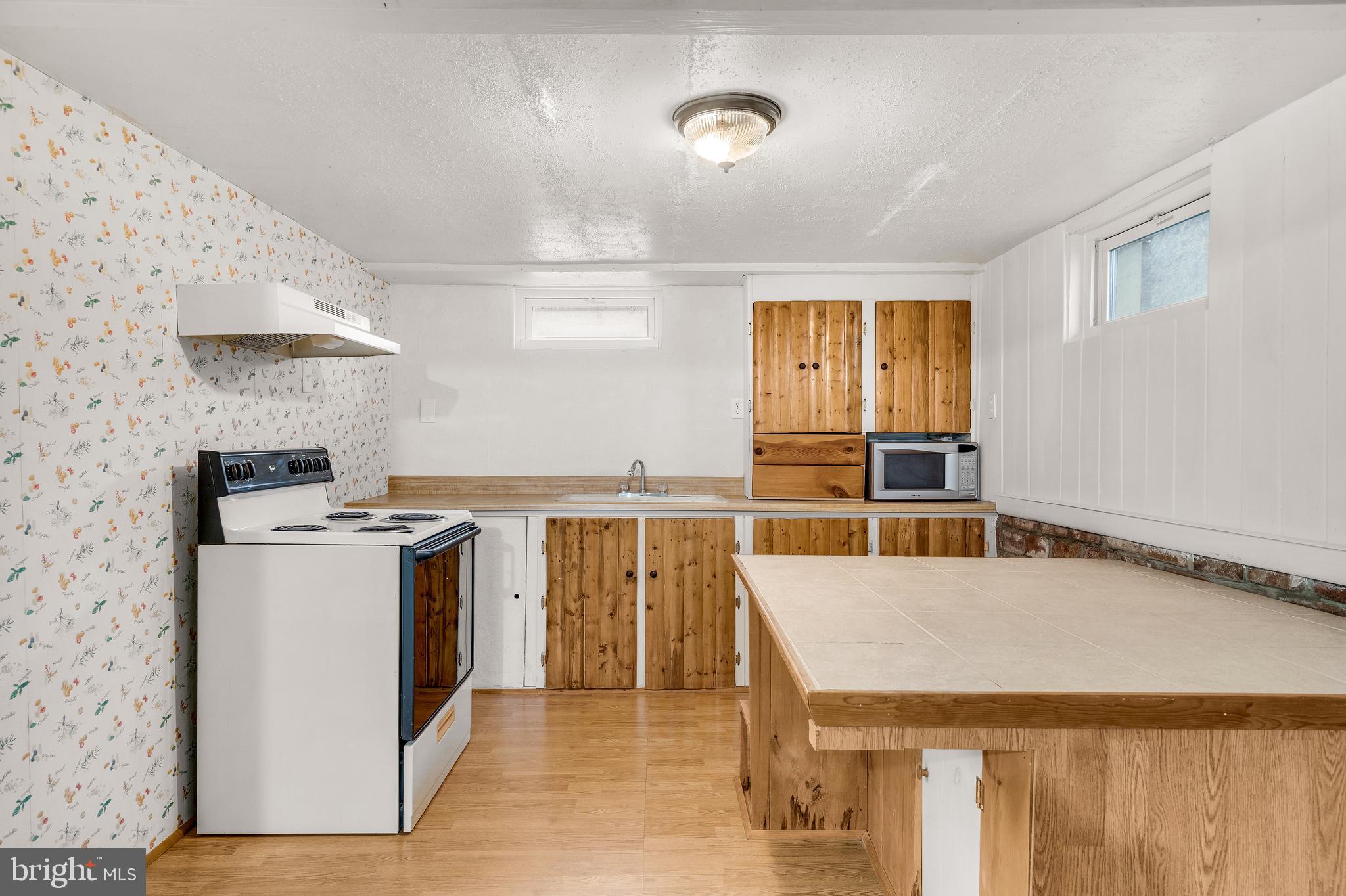 310 North Fairfax Boulevard Ranson, WV 25438 - Photo 28 of 36 a kitchen with a stove and a refrigerator