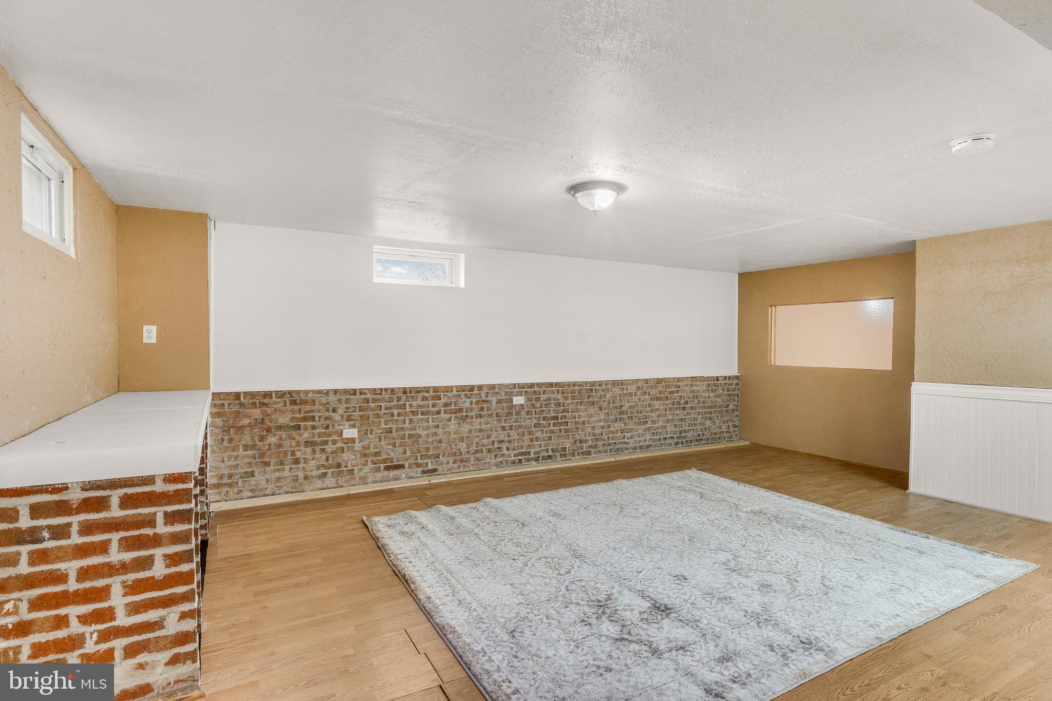 310 North Fairfax Boulevard Ranson, WV 25438 - Photo 29 of 36 an empty room with wooden floor and windows